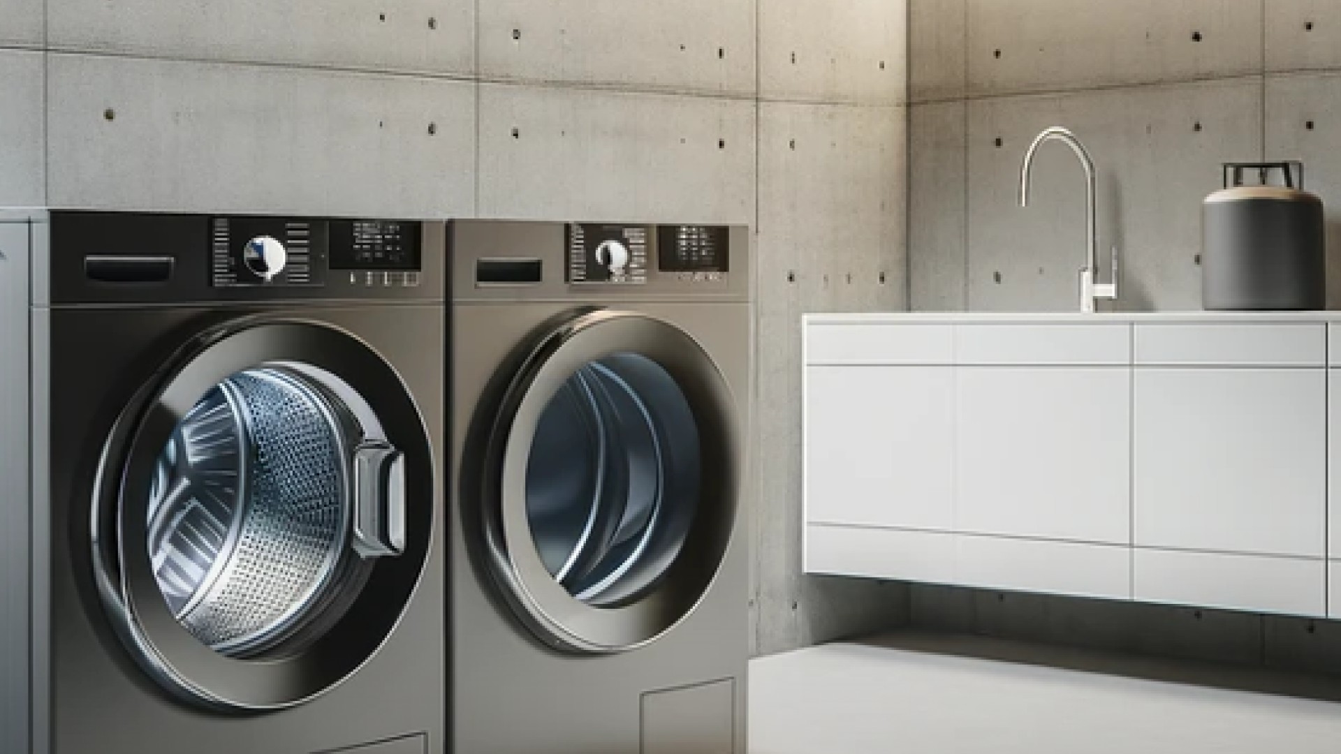 Two dark, stylish washing machines in the laundry room.
